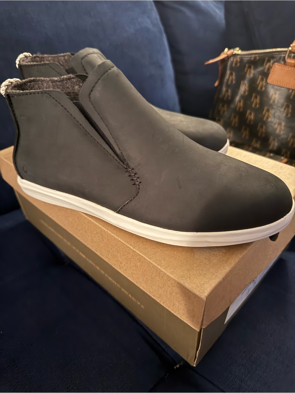 OluKai Black Slip-On Casual Leather boots  with White Sole